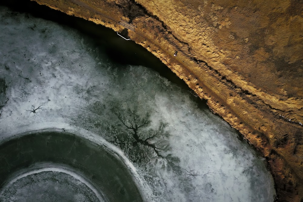 A drone shot of a frozen lake in Bozeman