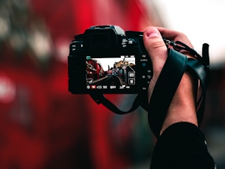 black DSLR camera capturing road