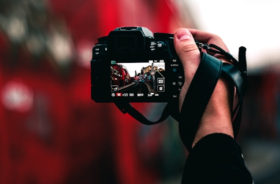 black DSLR camera capturing road