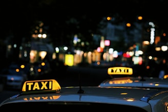 shallow focus photography of Taxi signage