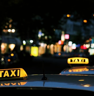 shallow focus photography of Taxi signage