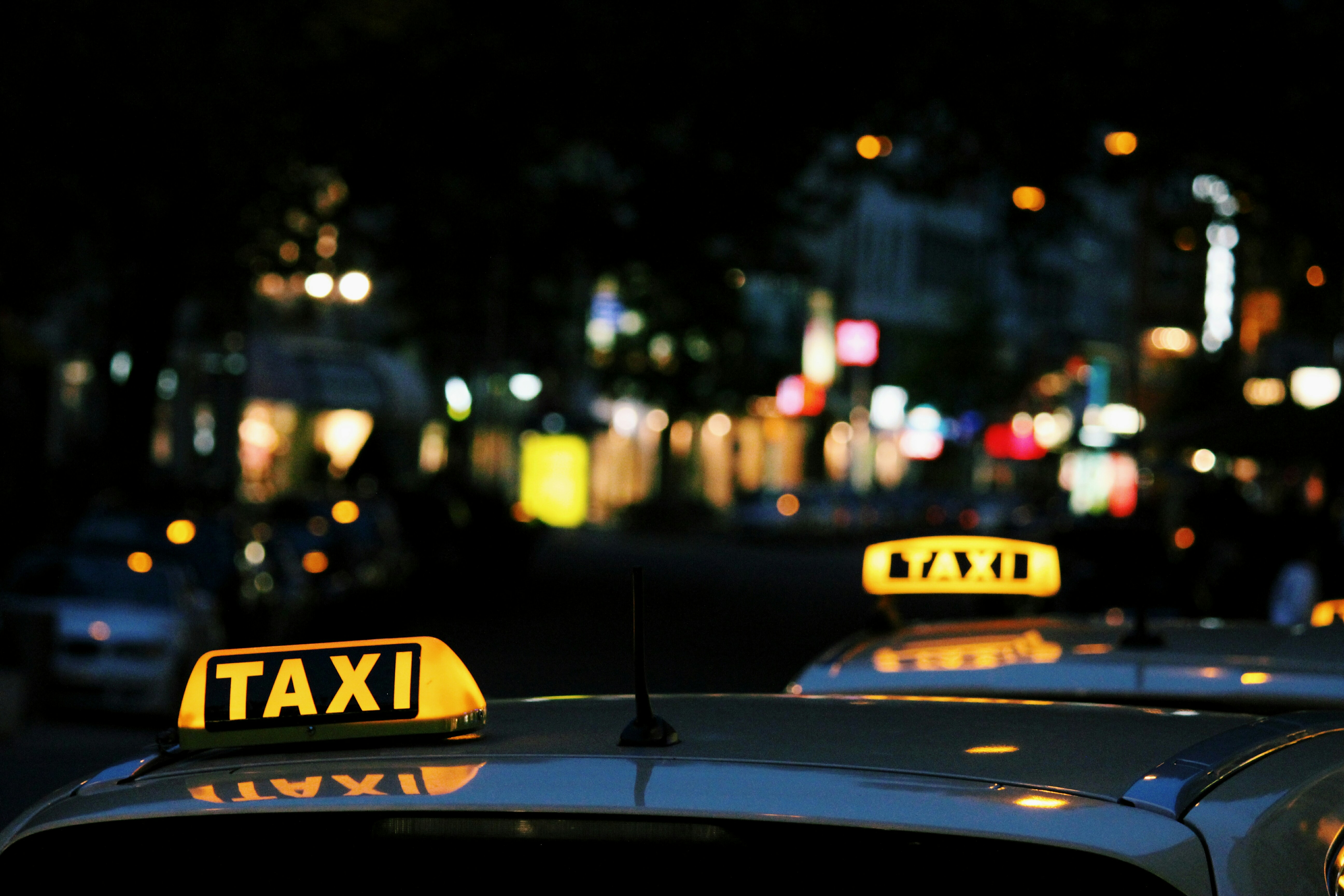 shallow focus photography of Taxi signage