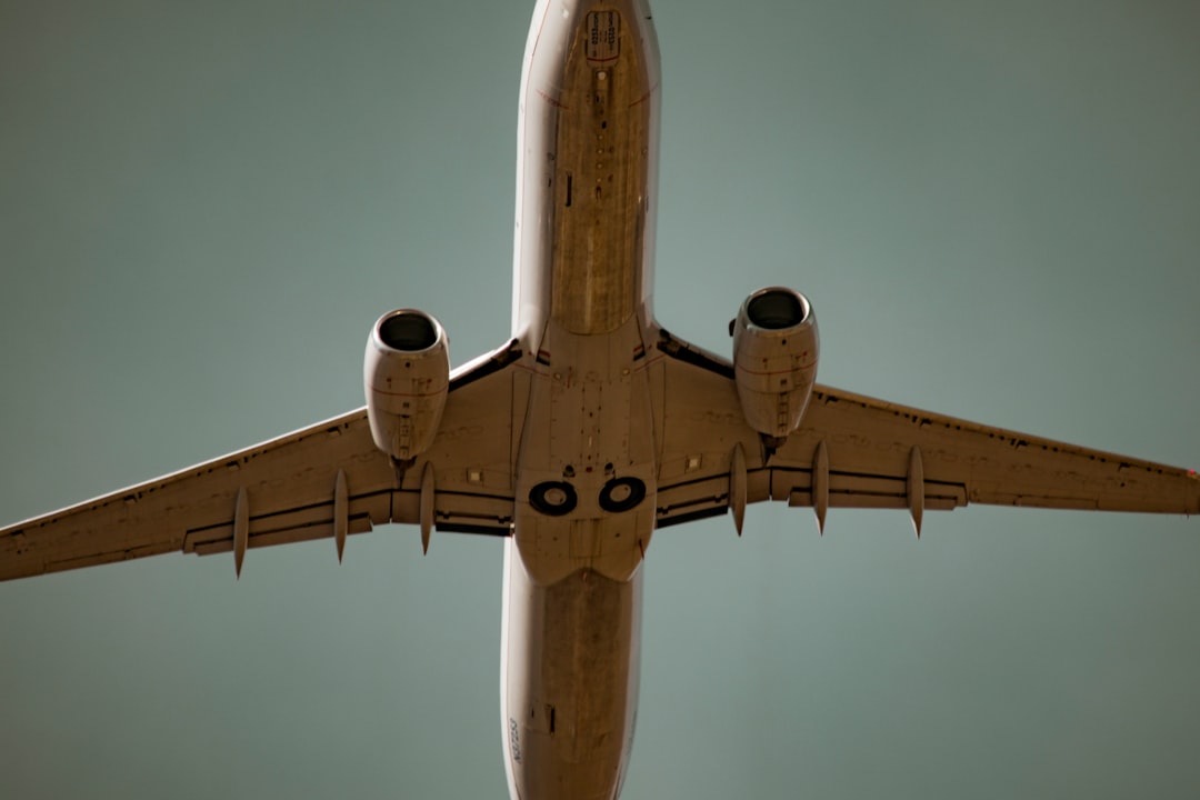 low angle photography of white airliner