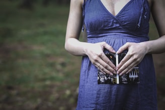 pregnant woman holding her tummy