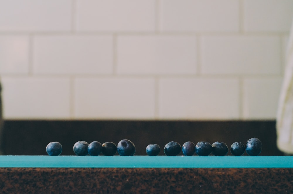 a group of blueberries sitting on top of a counter