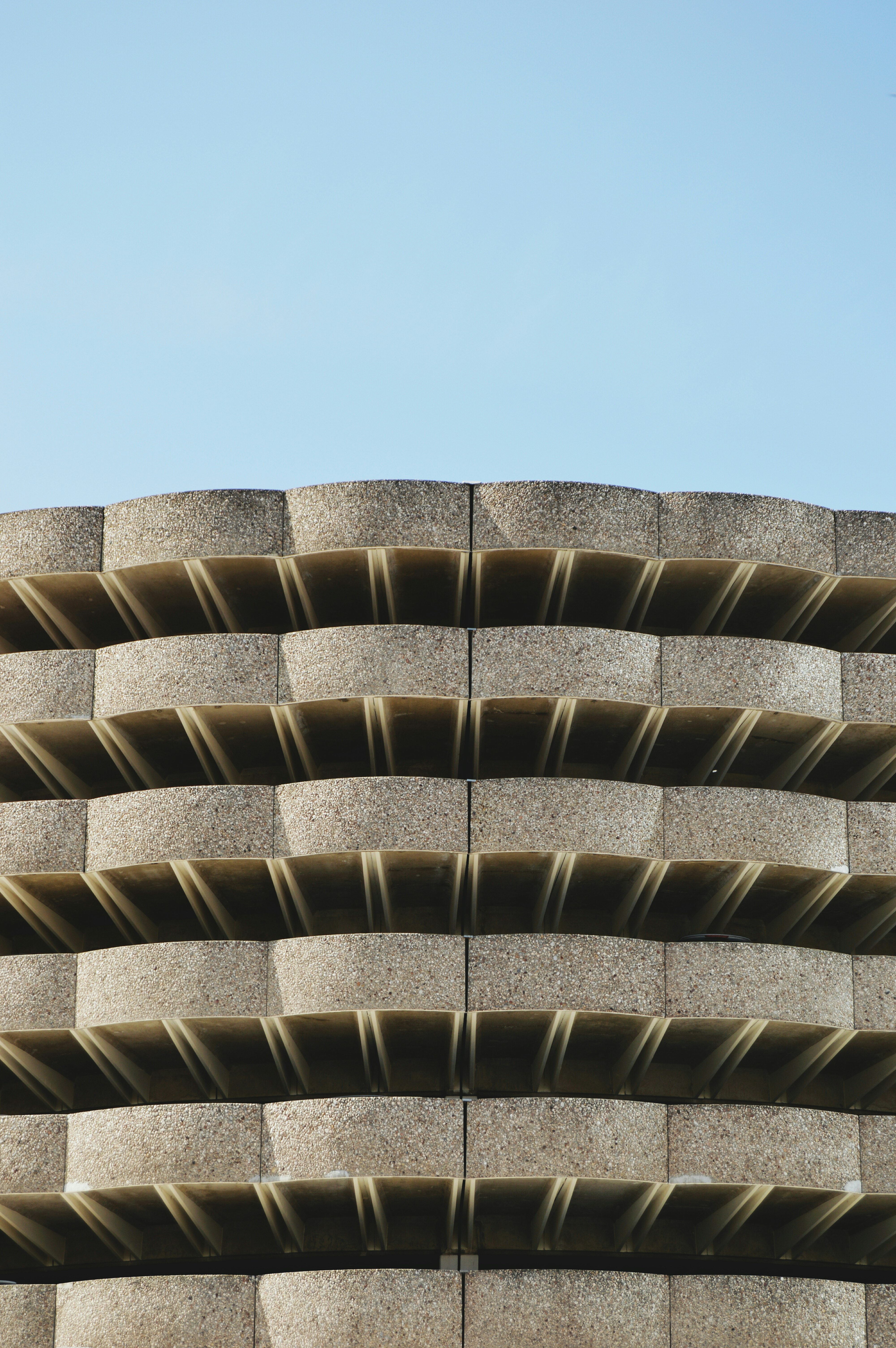 The concrete exterior of a multi-story parking lot