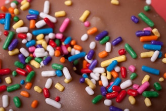 A close-up of a delicious donut with sprinkles.