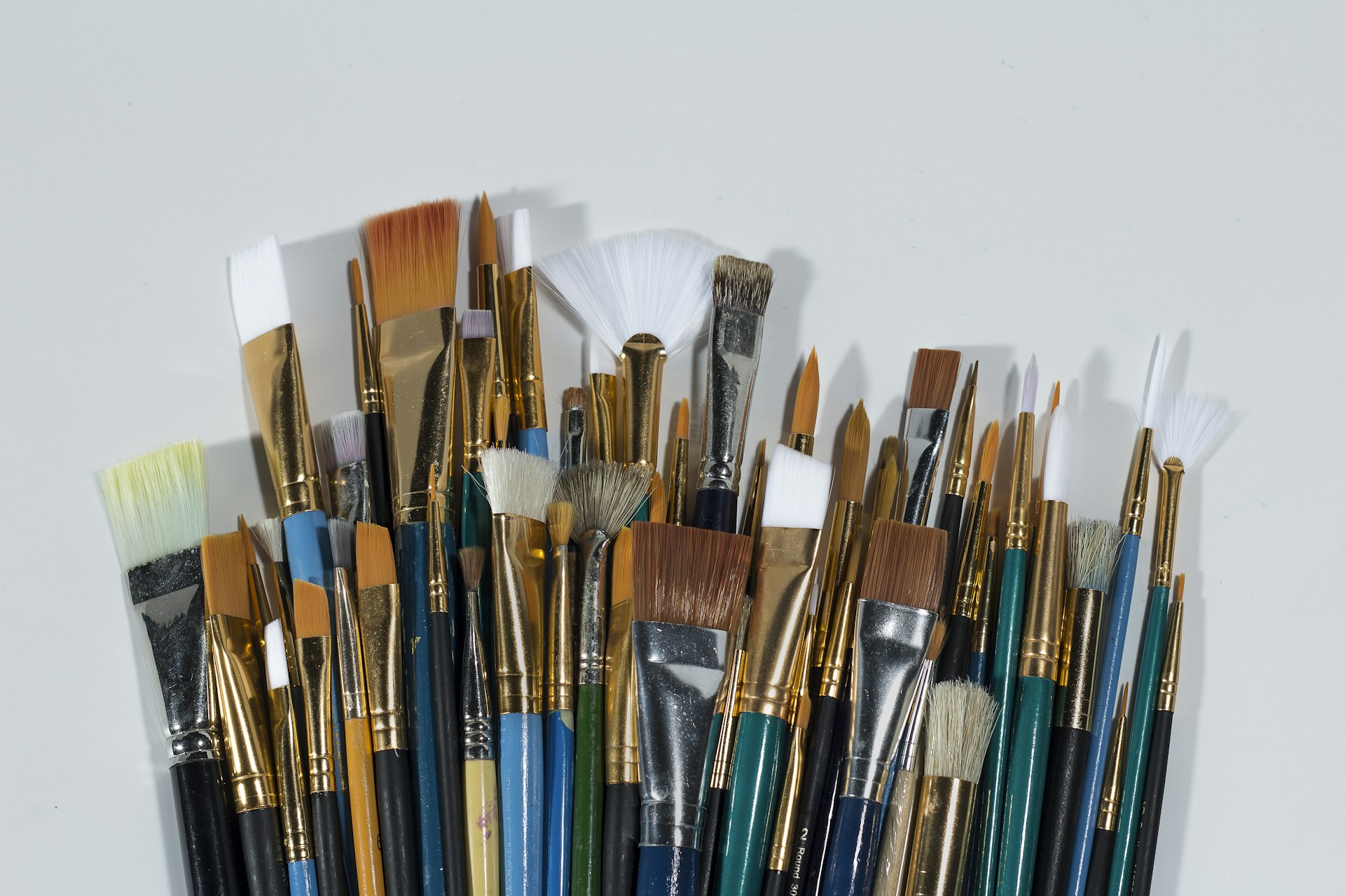 woman wearing yellow long-sleeved dress under white clouds and blue sky during daytime