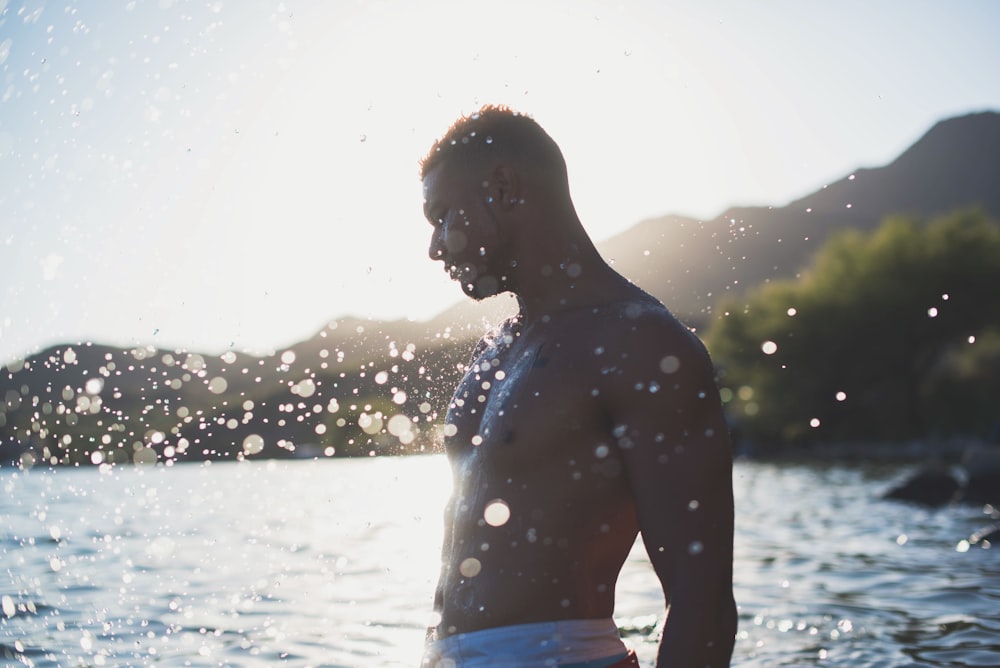 a man standing in a body of water