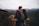 man kissing woman's forehead