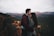 man kissing woman's forehead