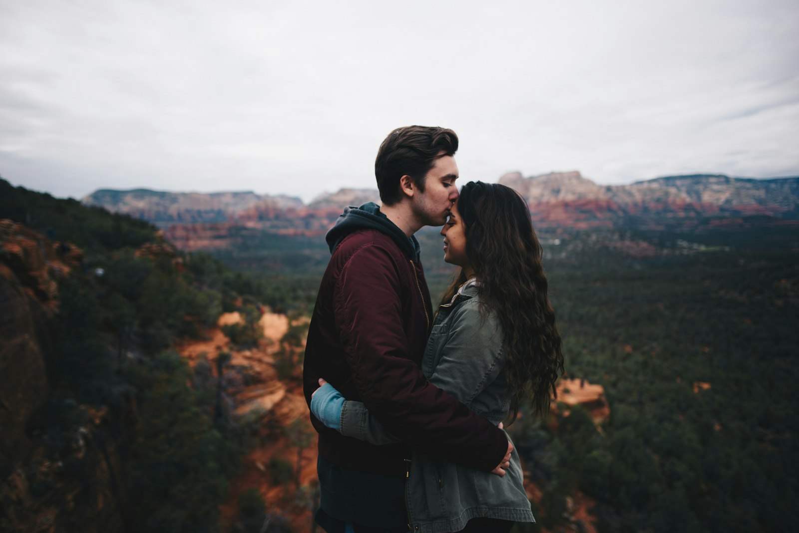 Nikon D750 + Nikon AF-S Nikkor 24mm F1.8G ED sample photo. Man kissing woman's forehead photography