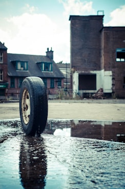 vehicle tire on pavement with water