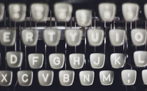 Close-up of typewriter keys with a soft-focus background.