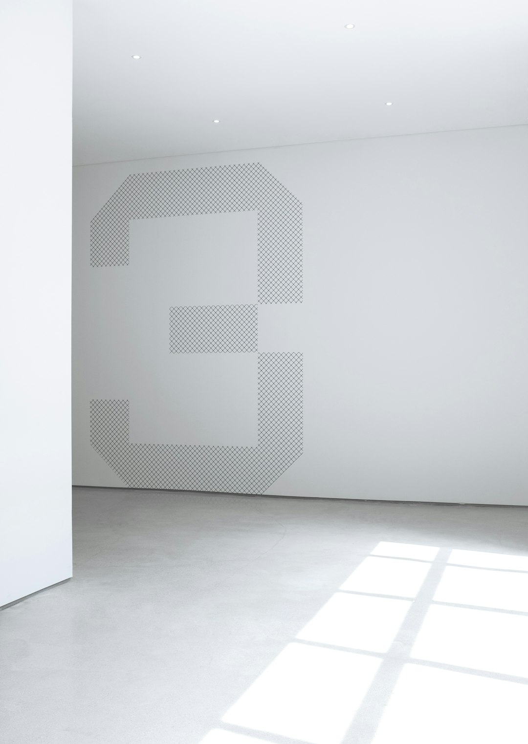  photo of white concrete wall inside room wall