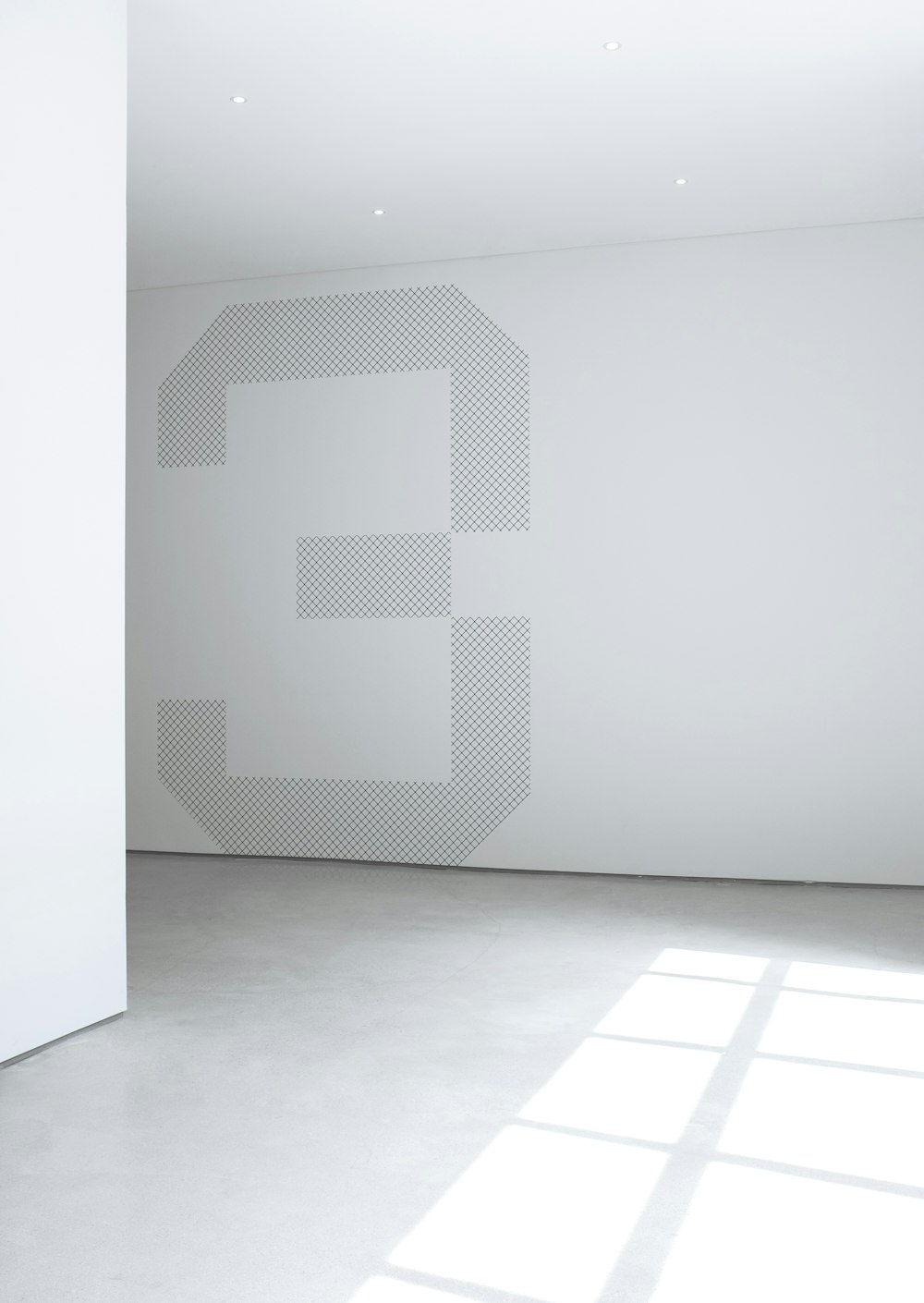 Foto der weißen Betonwand im Raum