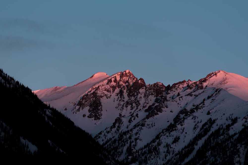 mountain covered in snow at golden hour