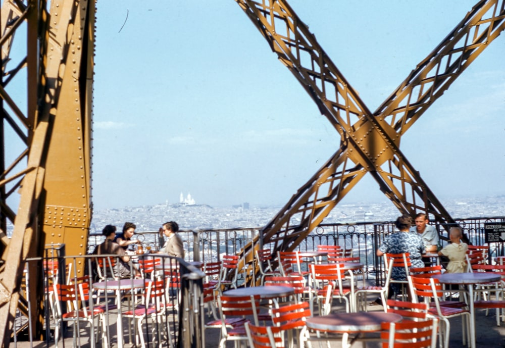 six person sitting on top of building