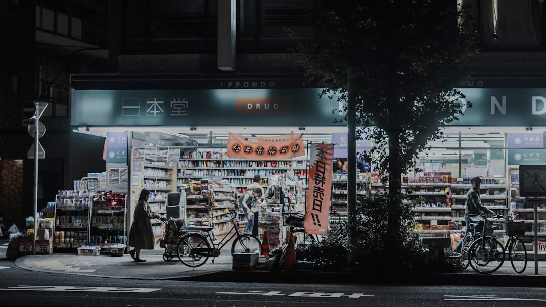 photo of man and woman standing near bicycles and opened establishment