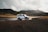 white car crossing body of water