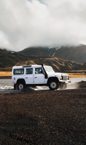 white car crossing body of water