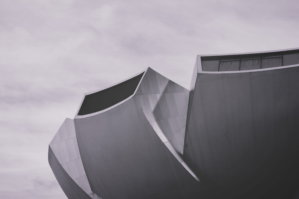 grey and white architectural building under daytime sky ]