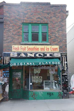 Bright and inviting storefront of sultana&mangan@ with a display of fresh smoothies and snacks.