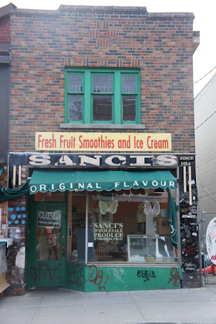 Bright and inviting storefront of sultana&mangan@ with a display of fresh smoothies and snacks.