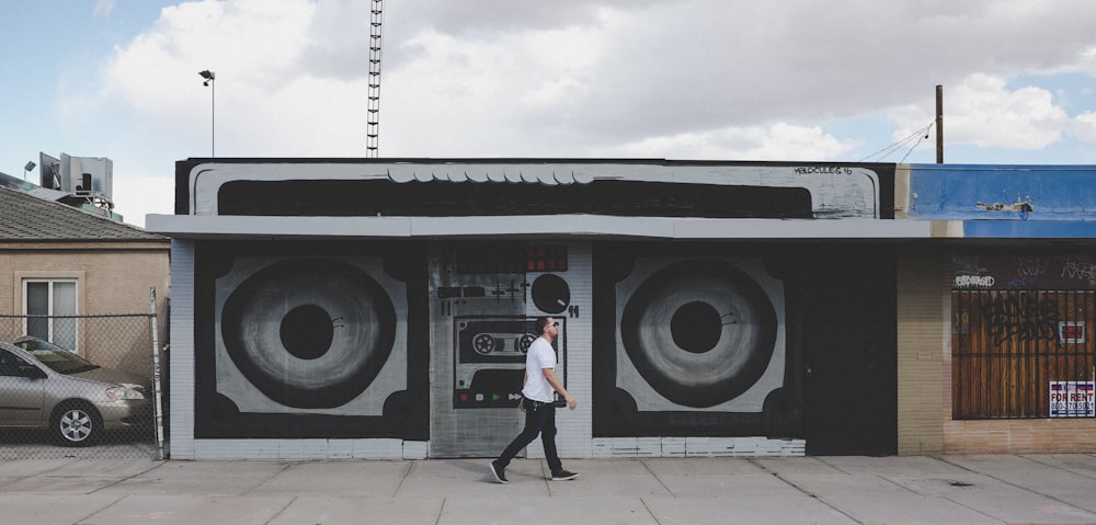 man walking near wall