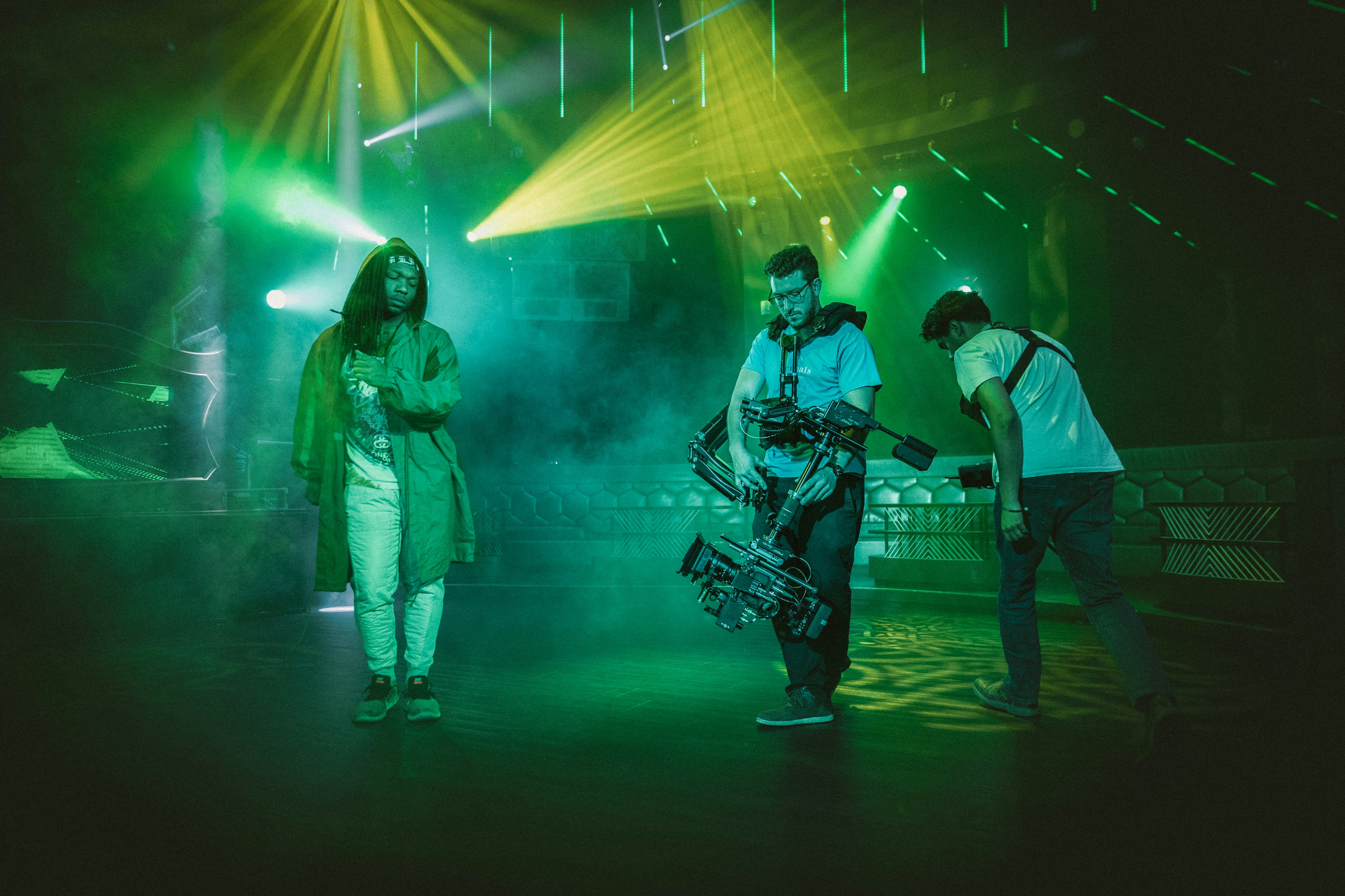 photography of three men playing musical instrument