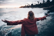 person standing near body of water