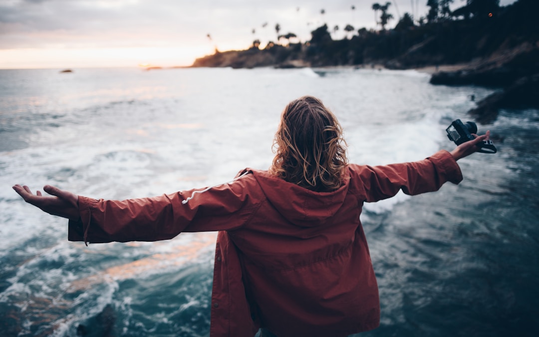 person standing near body of water