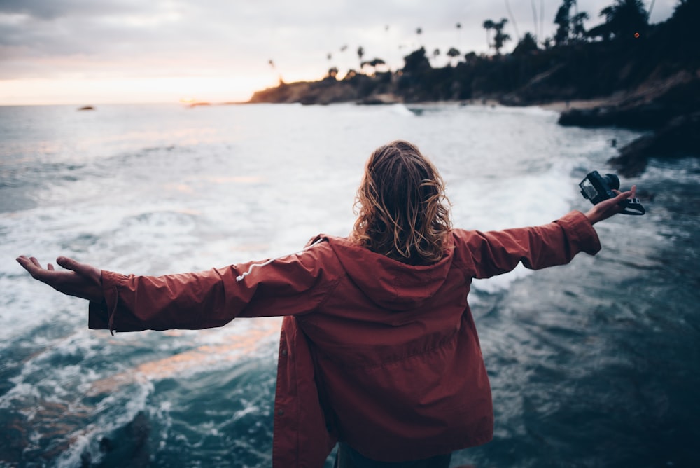 person standing near body of water