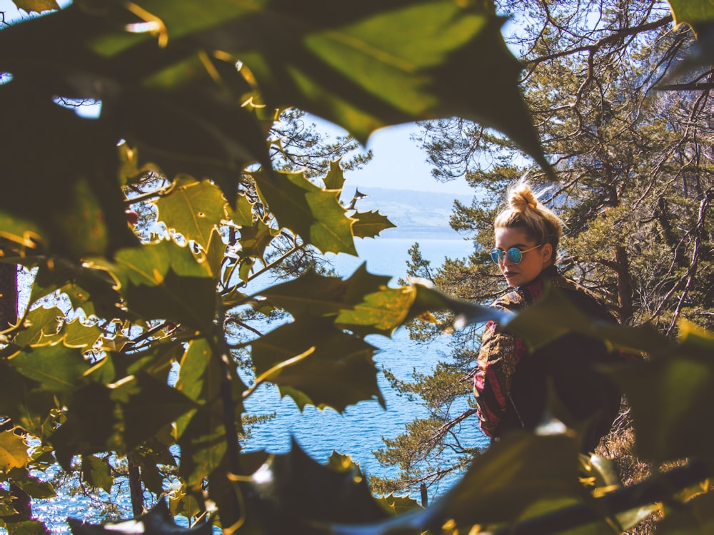 woman behind tree