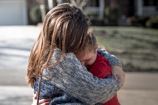 girl and boy hugging