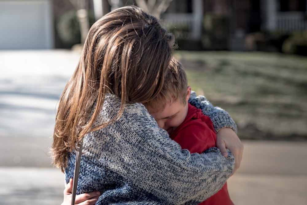 girl and boy hugging