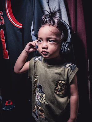Child undergoing a school audiometry test in a comfortable, child-friendly room.