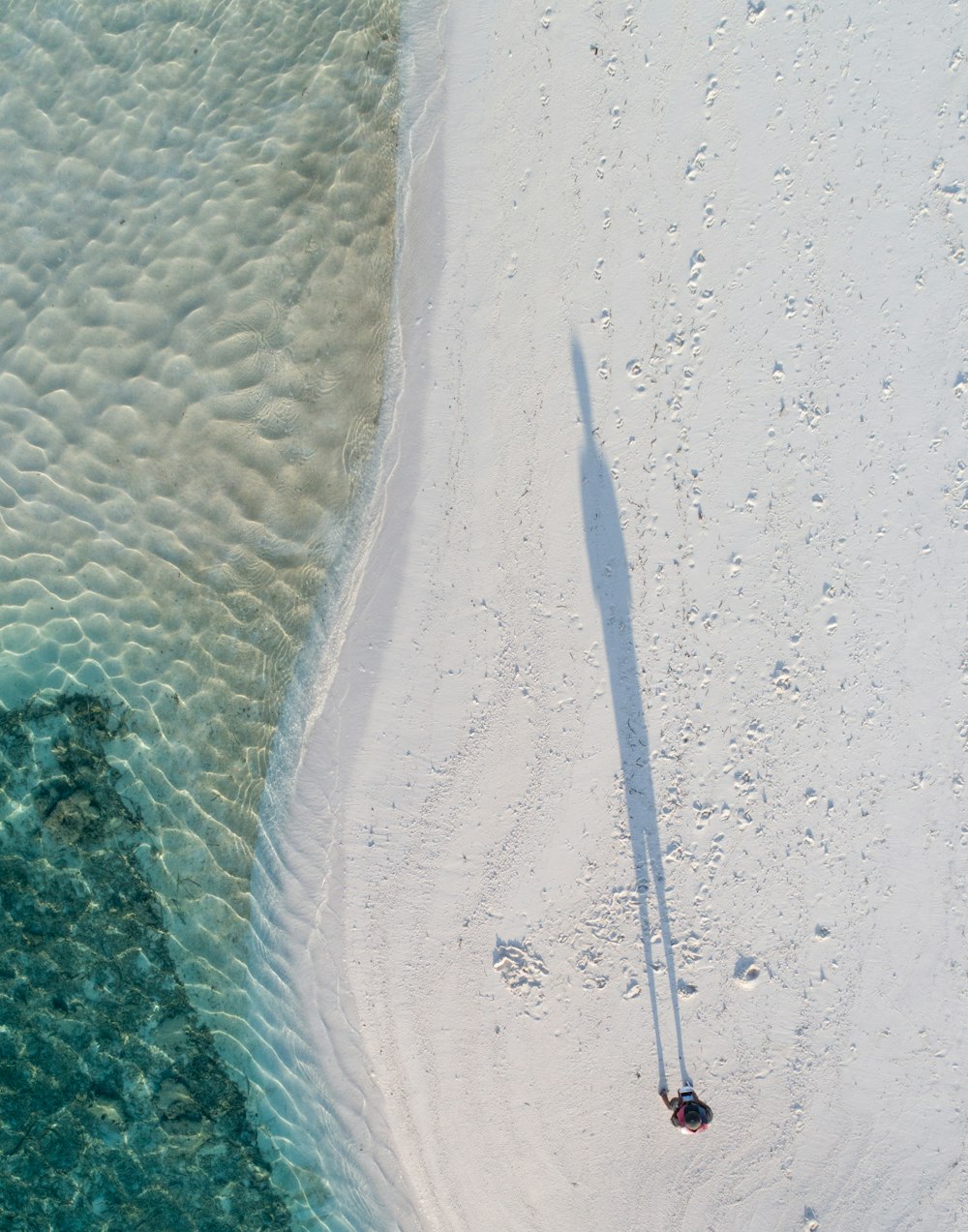 an aerial view of a beach and the ocean