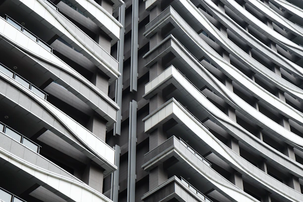Close-up of a sleek, contemporary apartment building with clean architectural lines.
