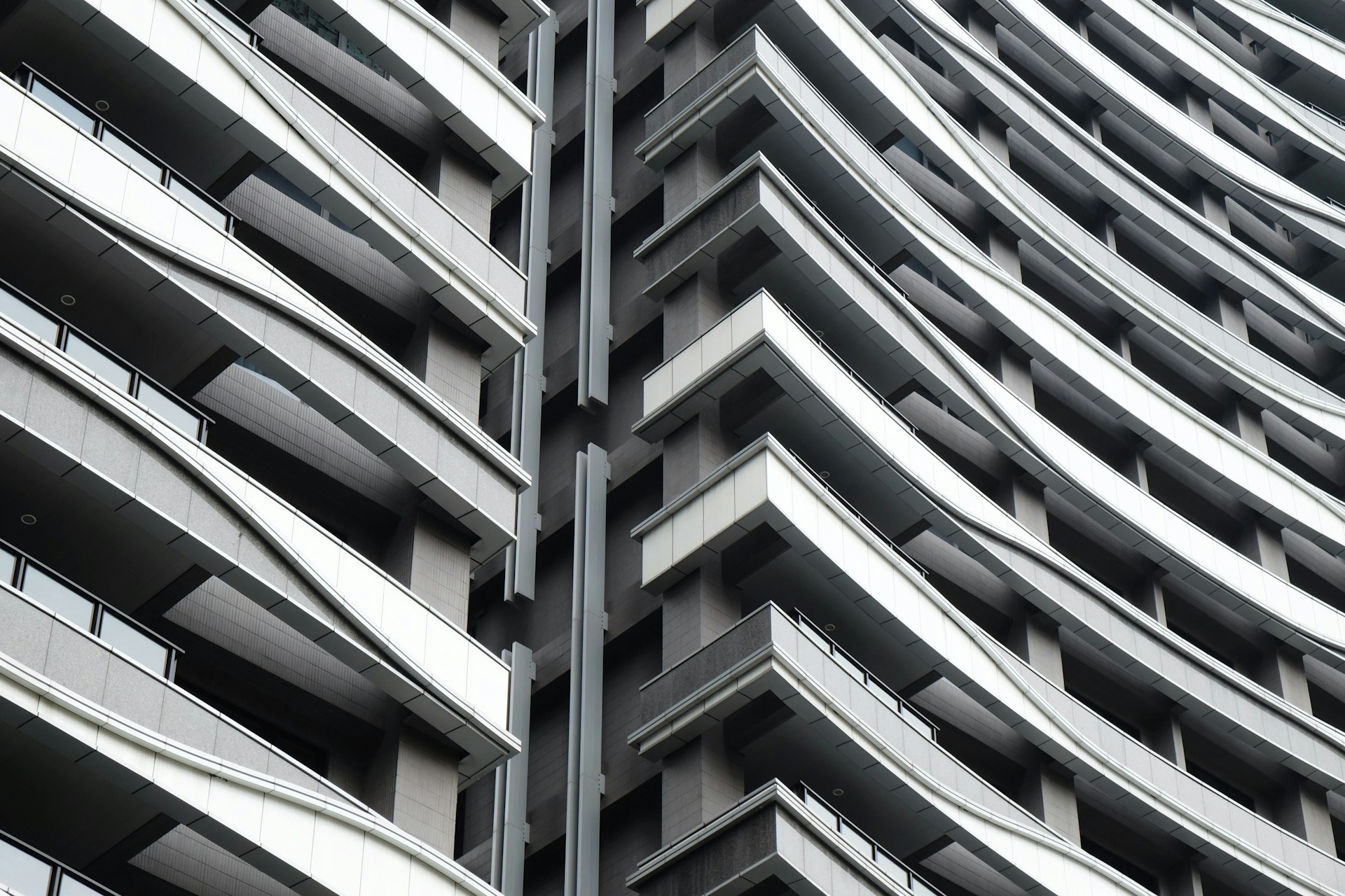 Close-up of the luxury residential building’s textured façade, highlighting the blend of timeless design and contemporary details.