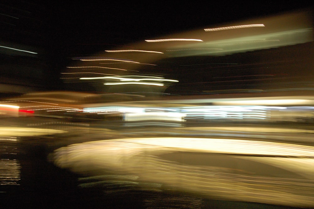 a blurry photo of a city street at night