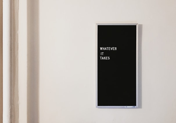 gray metal framed chalkboard with whatever it takes written