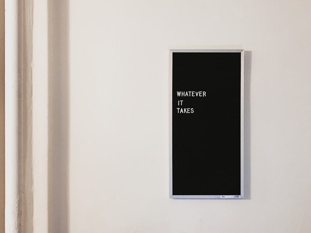 gray metal framed chalkboard with whatever it takes written