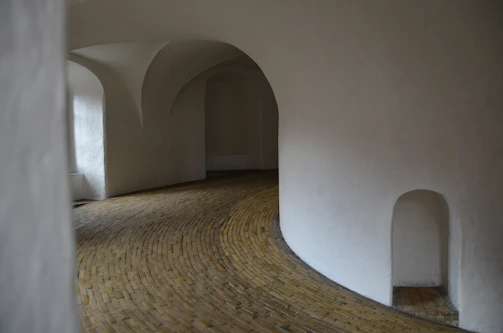 Interior hallway with smooth plaster walls and soft pastel paint tones.