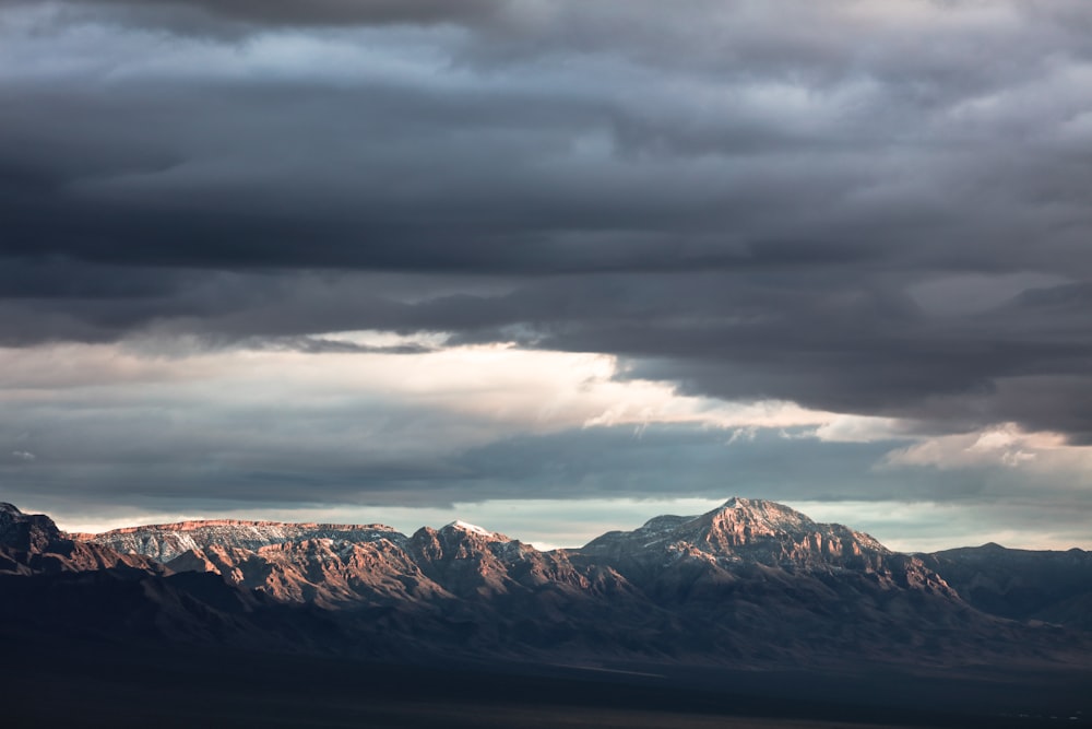 mountain under nimbus cloud