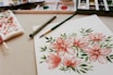 red petaled flower painting