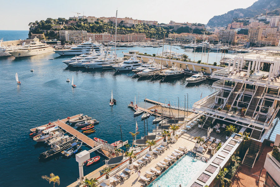 Aerial view of Port Hercule, Monaco, full of yachts beside the circuit