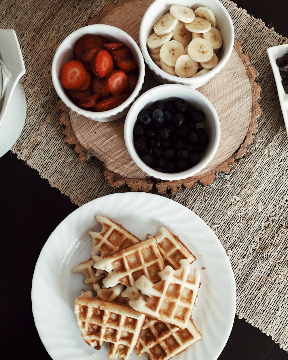 Waffles with strawberries, banana and blueberries