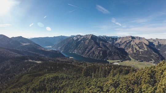 green trees and mountains under blue sky during daytime in Hochunnutz Austria