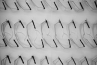 An array of safety goggles displayed on a shelf.